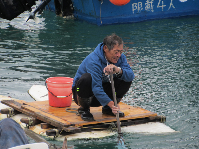 Guy paddling his raft