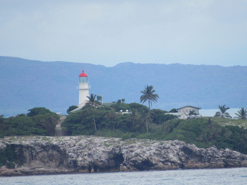 Lighthouse near a small island Cook found