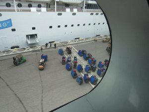 Watching luggage get on the ship