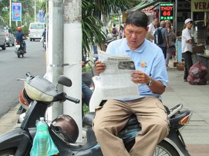 Typical man reading paper