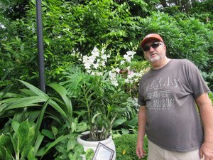Glenn with an Orchid plant