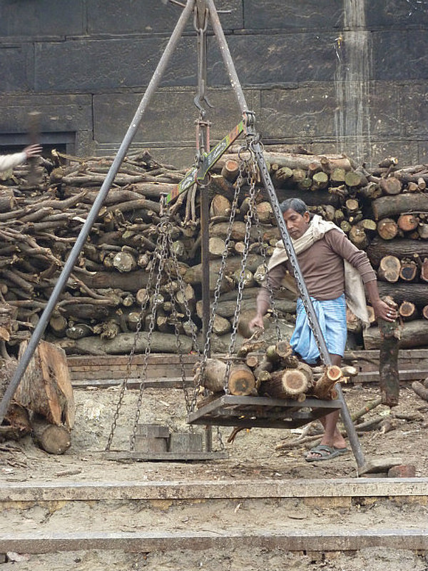 Weighing wood for burning pires