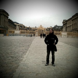 John in front of the Versailles Palace