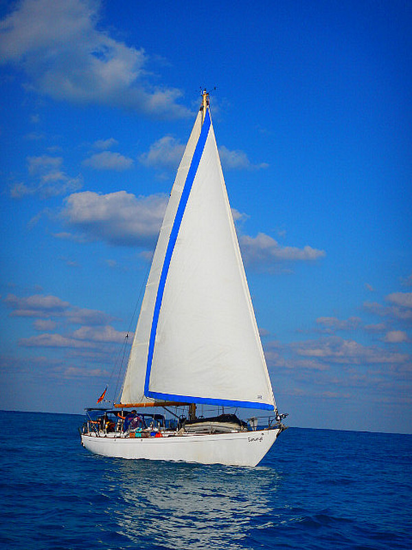 Simunye under sail on the bank.