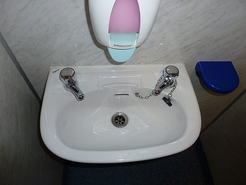 Wash basin with hot and cold spigots