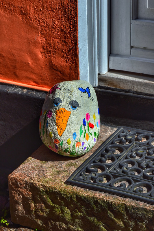 Painted rock on doorstep