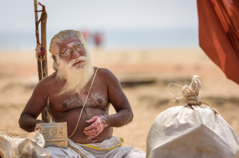 Sadu offering blessings on the beach