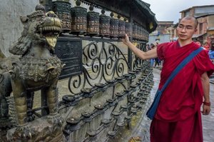 Monk spinning prayer wheels @ Swayambhunath Temple