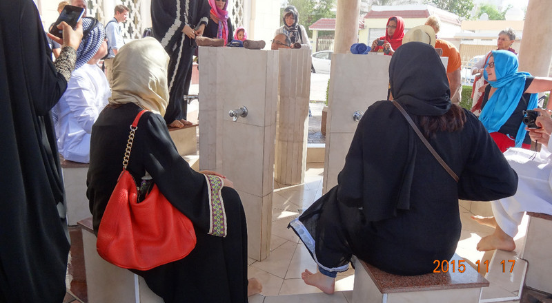 Tourists Try Out the Ablution Ritual at the Mosque