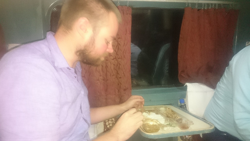 Phil eating thali on train