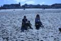 Mandi and Meg sitting in the sand at Bondi