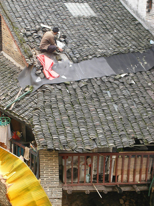 Fixing the roof near the hotel