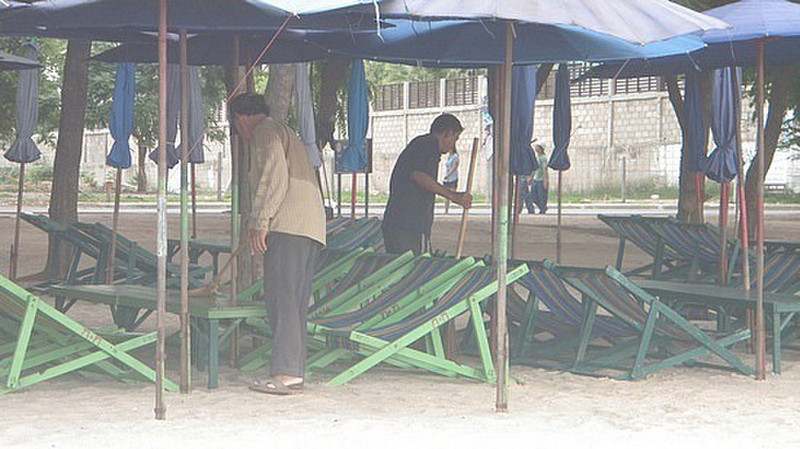 Preparing the beach chairs for the day