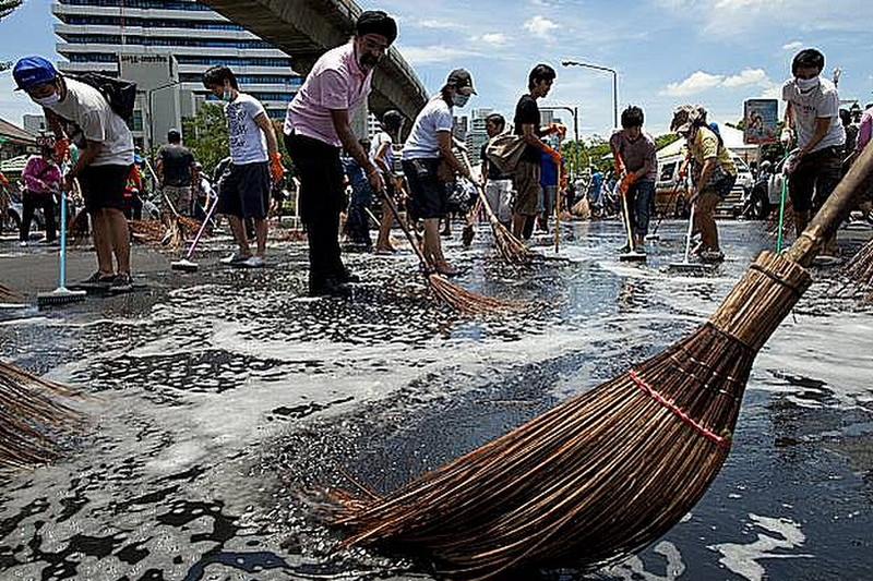 24 May  -  Bangkok residents scrub the streets 