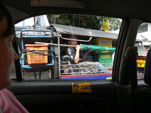 This man had NO room to move in the tuk tuk