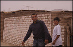 thumbnail.large.13.1338999955.miguel-and-neighbor-going-to-church