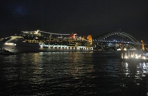 Night View Of Cruise Ship &amp; Bridge