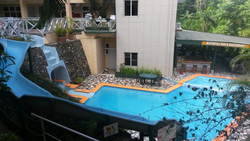 The swimming pool with water slide at the hotel