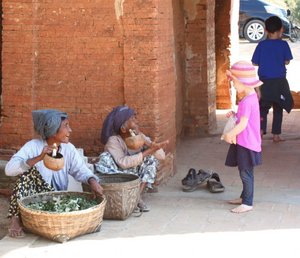 Women Offering Traditional Smokes to Siri, Bagan