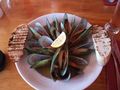 A large bowl of large mussels
