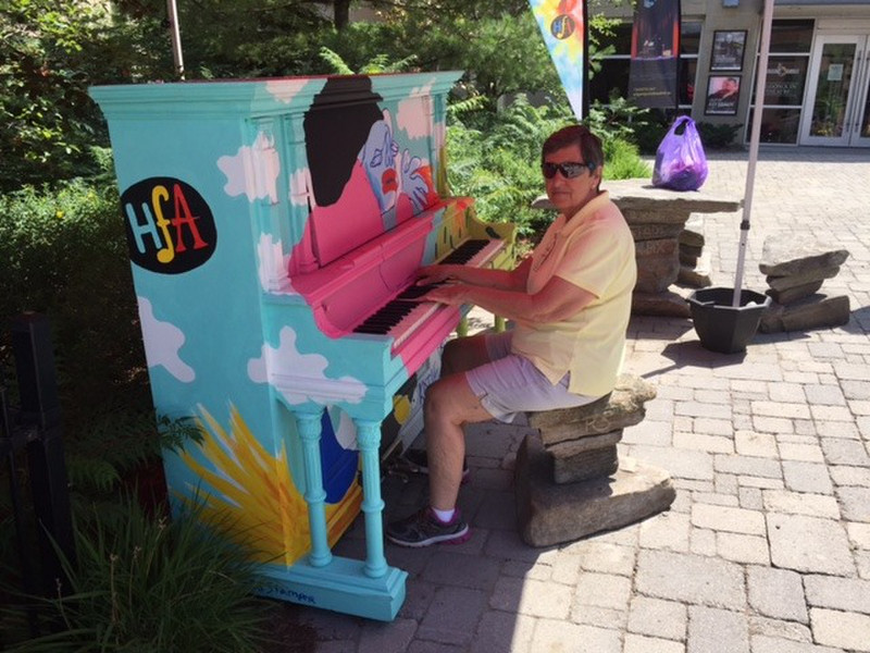 Playing piano in Downtown Huntsville, Ontario