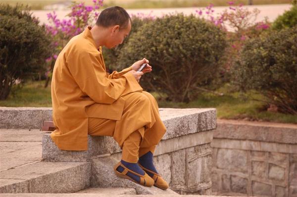 Monk checking his mail