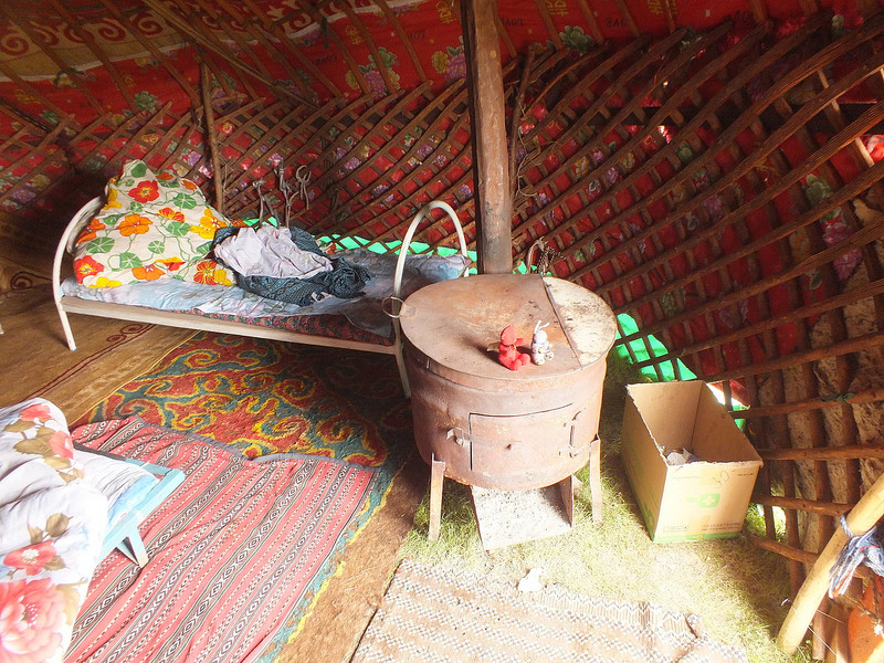 Getting warm on the &quot;dung&quot; heater in our Yurt