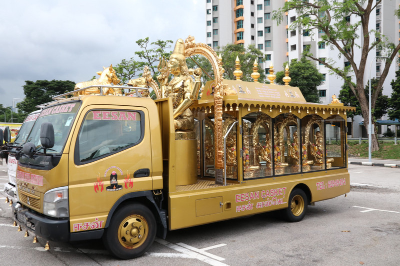 A truck laden with golden buddhas
