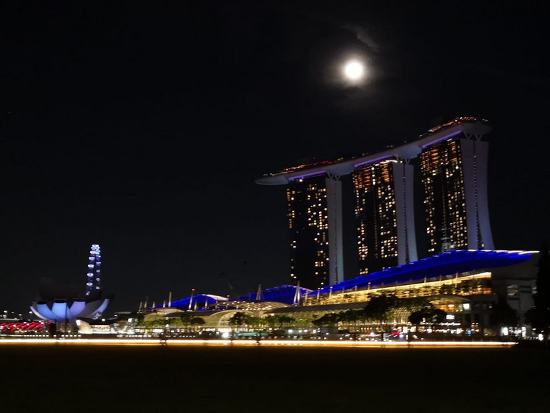 Full moon rising above the Marina Bay Sands Hotel