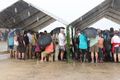 Tonga - torrential down pour as the crowd scramble for shelter