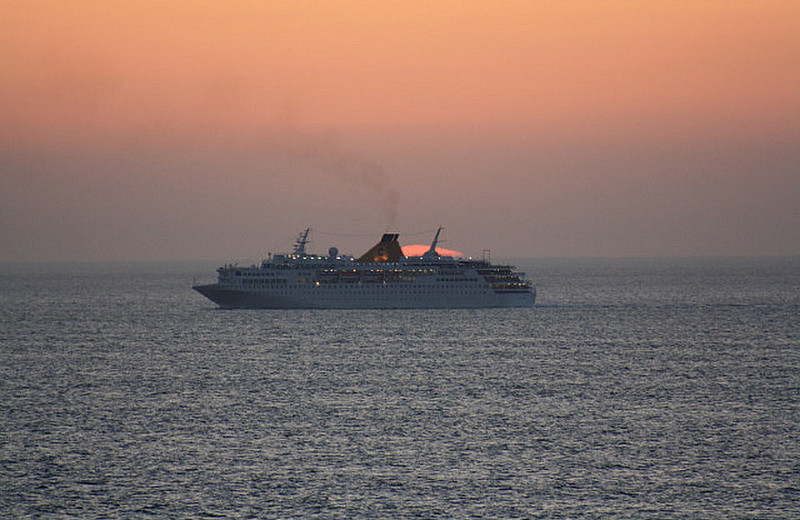 A Costa ship sailing in to the sunset