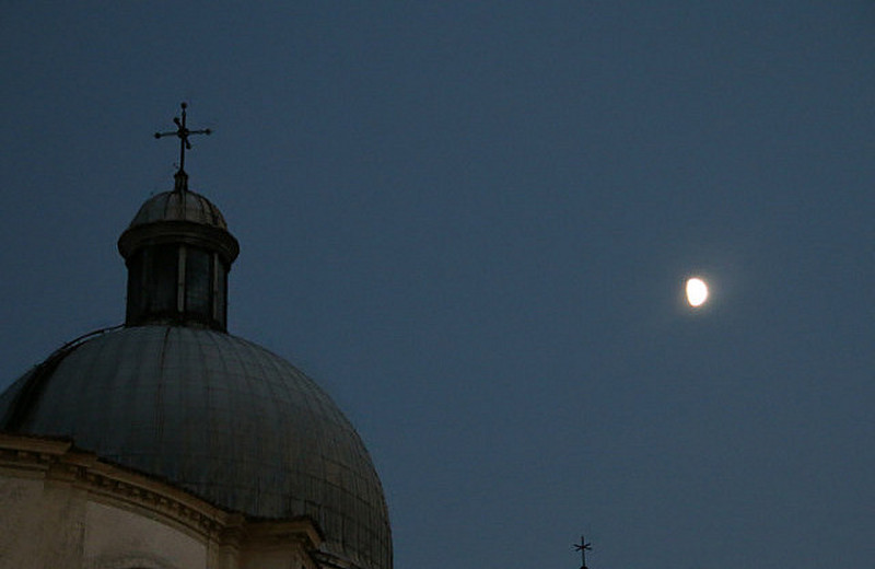 The moon rising over Venice