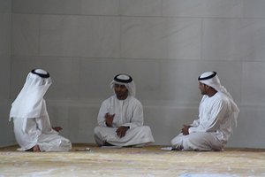 Three men in a mosque, (Abu Dhabi)