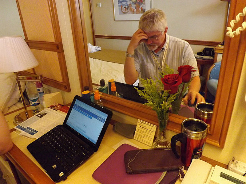 The author deep in thought (with red rose!)