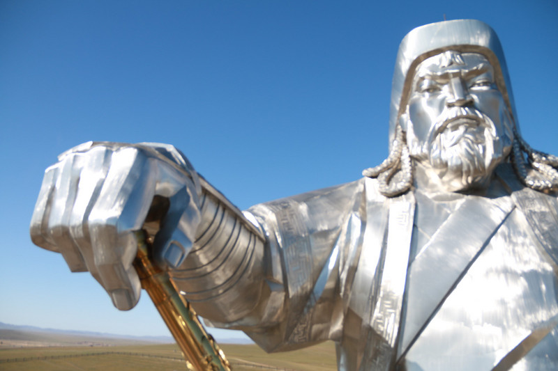 Genghis holding the golden whip | Photo