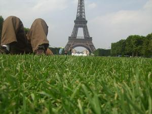 Laying down in front of the Eiffel Tower