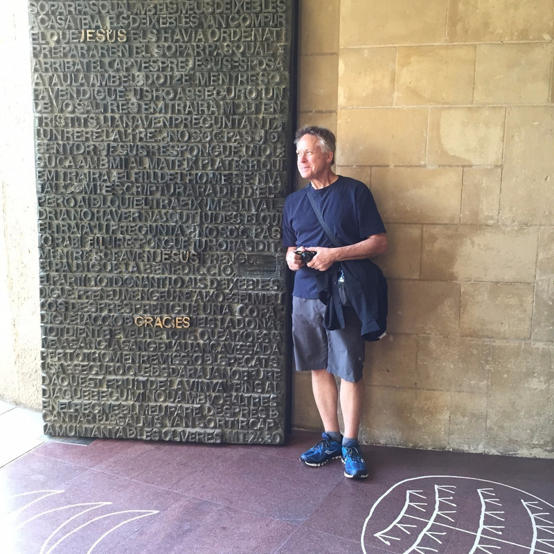 Mike at a bronze door at the Glory Facade
