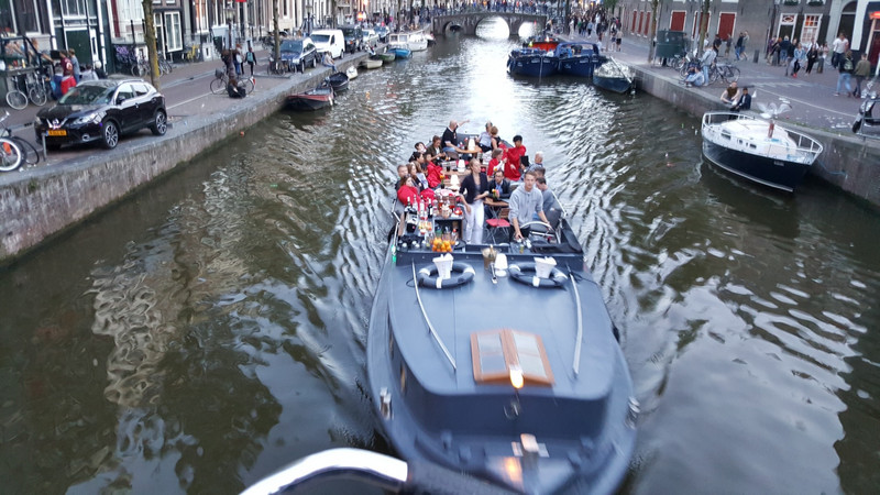 A group of folks dining in style on a canal cruise