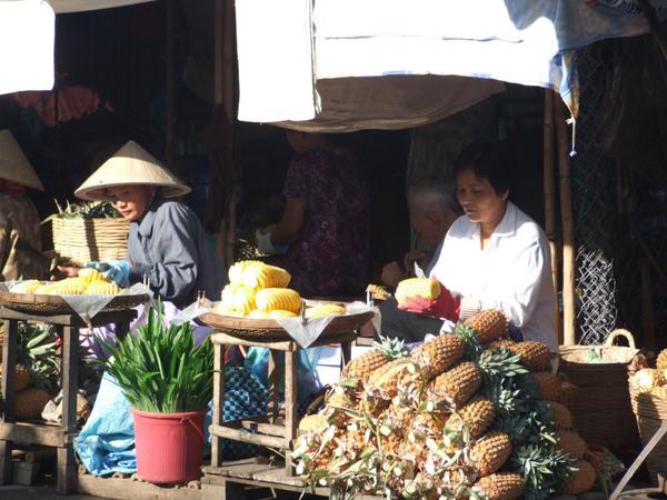 Ladies selling pineapple