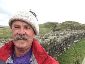 On Hadrian’s Wall, out in the wind and in a good mood.