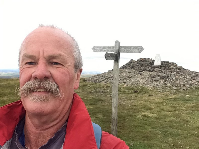 The holy trinity. Cairn, trig point and signpost.