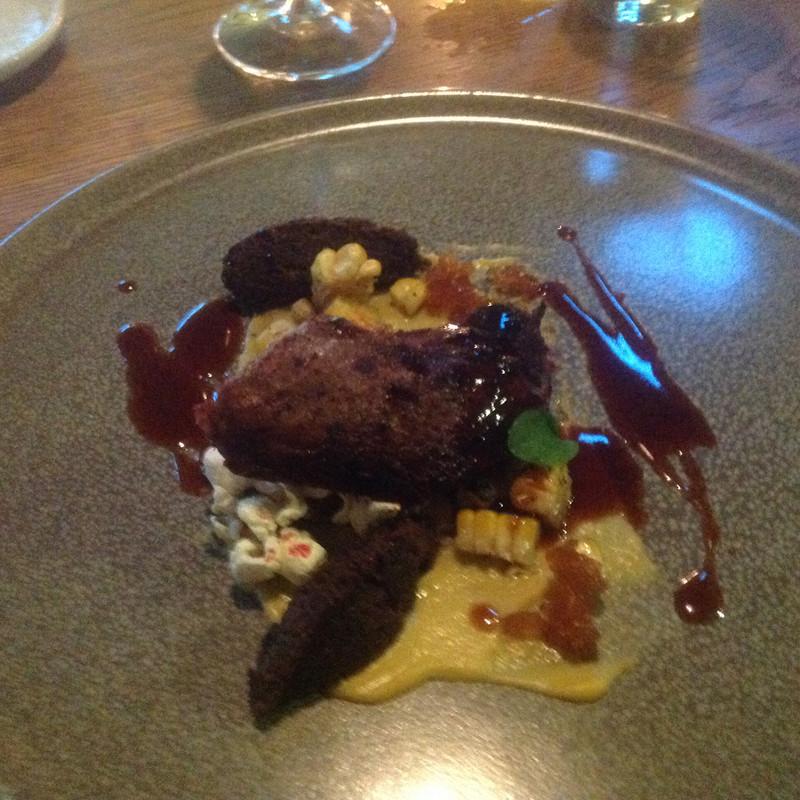 Pigeon with truffle popcorn, corn and jus.