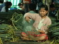 girl mending fishing nets