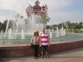 Tourists enjoying Patuxai and fountains