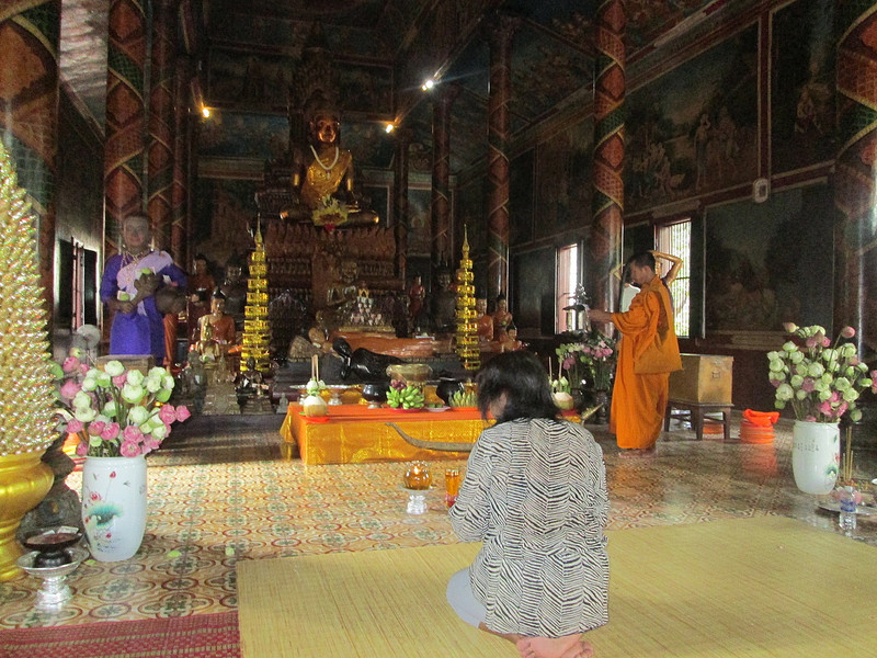 Jai making an offering at Wat Phnom