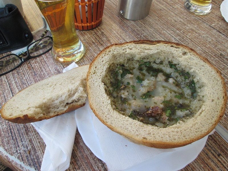Fatty soup in large bread roll