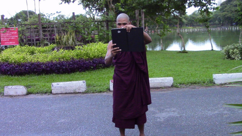 Monk taking a photo