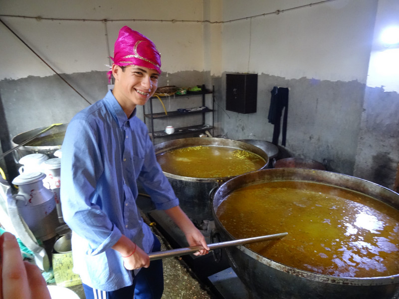 Charlie gives the dhal a stir