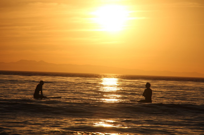 Sunset and Surfers
