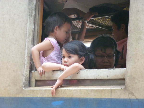 Little girl watching out of the train